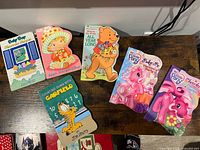 All six board books laid out showing covers