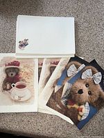 Fronts of multiple card designs and stacked envelopes displayed