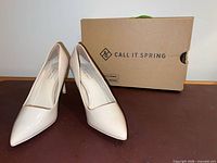 Pair of nude Call It Spring pumps with box
