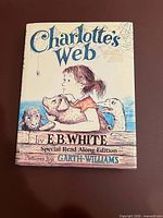 Front cover with title, author, illustrator and edition details visible