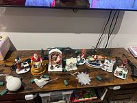 All ornaments and cords laid out on wooden surface