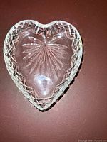 Top view of heart-shaped cut glass dish showing starburst pattern
