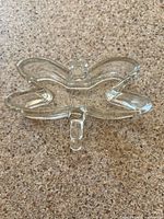 Top view of clear glass butterfly trinket dish