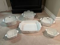 Full 11-piece CorningWare set showing six dishes with lids