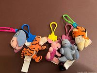 All four Disney character plush keychains grouped