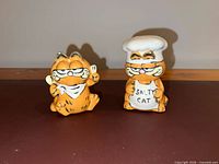 Both Garfield ceramic shakers front view