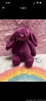 Front view of purple Jellycat bunny plush sitting upright