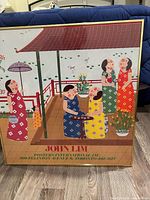 Front view of framed John Lim poster print, showing artwork and gold-tone frame