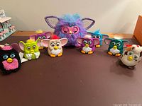 Group shot of all ten Furbys on tabletop