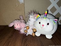 Front view of all three plush toys