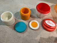 Opened jars showing interiors and separate lids