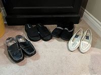 All four pairs lined up showing overall styles and wear