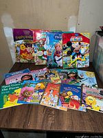 All books spread on tabletop showing covers