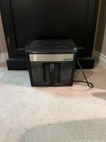 Front view of Staples MailMate shredder showing body and power cord