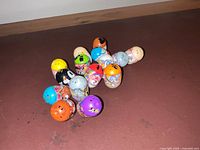 All 15 capsule toys grouped on surface
