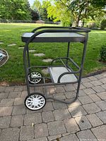 Side view showing full cart, frame, shelves, and wheels