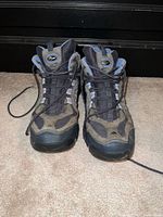 Front view of both boots showing uppers, laces, tongue logos