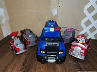 All five Paw Patrol plastic vehicles displayed together