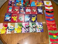 Group shot of all sealed promo packs laid out on table