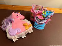 Unicorn compact closed beside cylindrical mall playset closed