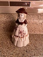 Front view of porcelain lady bell