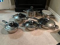 Group shot showing all pots, pans and lids assembled