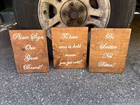 Front view showing all three signs with text visible