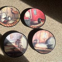 Top view of four illustrated duck plates