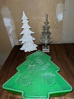 Group shot showing all three items: clear glass tree, white resin tree, green plastic tray
