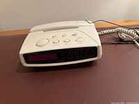 Front view showing digital display and control buttons