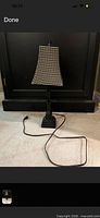Full view of lamp showing base, column, shade, and power cord