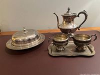 Full set showing teapot, sugar bowl, creamer on tray, and covered serving dish