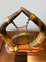 Overhead view showing horn mounts, chain, gong, base and striker