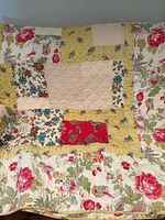 Front view of quilt showing overall patchwork pattern