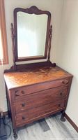 Full view of dresser with attached mirror showing drawers and overall wear