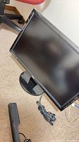 Front angled view of BenQ 24" monitor with cable