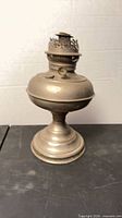 Full view of brass kerosene lamp front