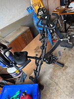 Full view of black foldable exercise bike showing LCD console, frame, pedals and seat