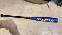 Full view of blue Easton Stealth bat showing barrel graphics and handle