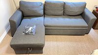 Full view of gray three-seat sectional with chaise configured left side