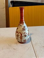 Full front view showing bottle neck, teardrop form and painted motifs