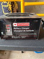 Front view showing Motomaster branding, gauge, 6AMP-12V rating