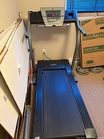 Treadmill unfolded, full view of deck and console