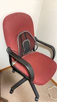 Front view of red/burgundy fabric office chair with mesh lumbar pad