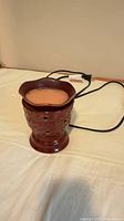 Wax warmer showing full unit with power cord and dish