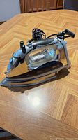 Side view of Shark Euro-Pro GJ490 steam iron with cord