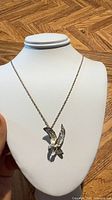 Full view of sterling silver eagle pendant necklace displayed on bust