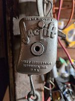 Jacklift housing showing brand and 2000 lb capacity marking