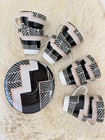 Stacked teacups and saucer showing full geometric pattern