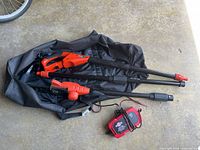 Pole saw components and charger in carry bag
